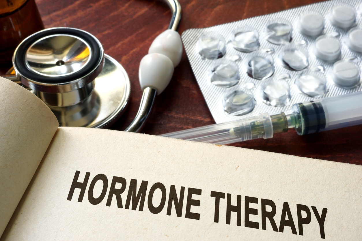 Book with words hormone therapy on a table.