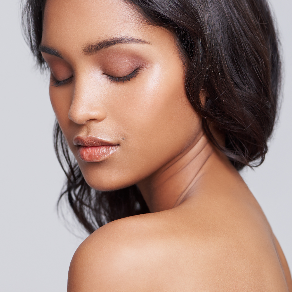 Beautiful woman with glowing, brown skin