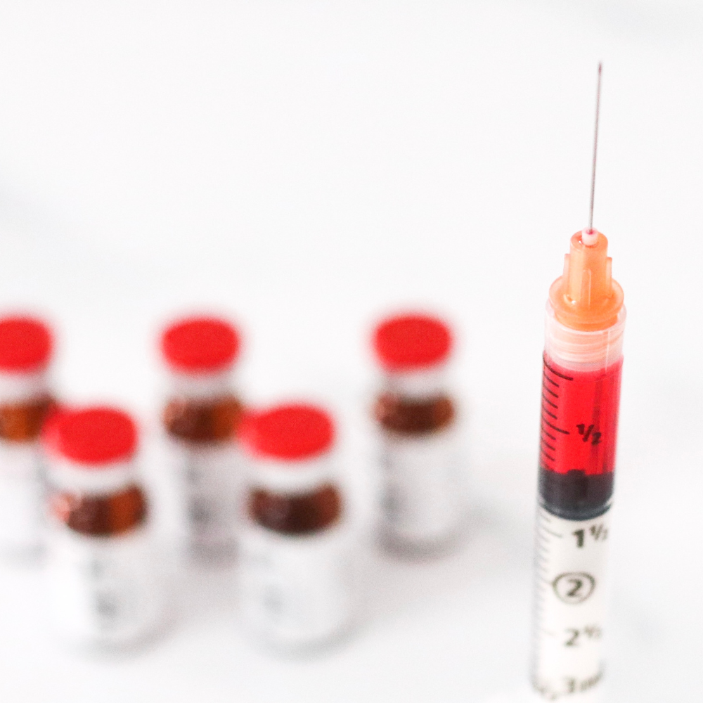 syringe with vitamin injectables inside